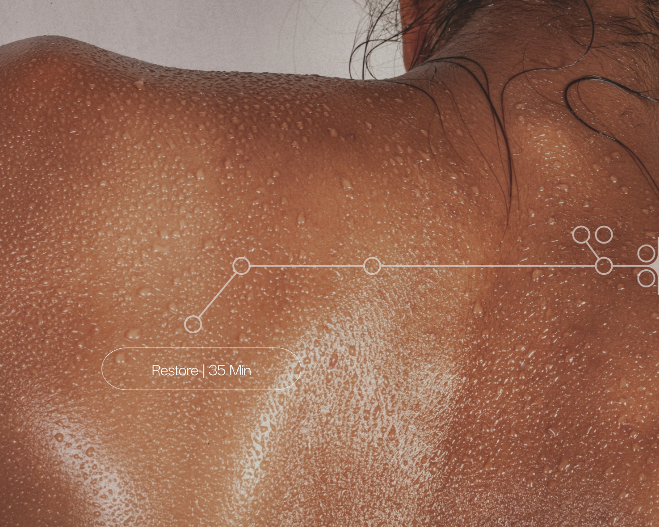 Close-up of a person's back with water droplets, recovery themed